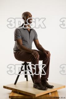 Sitting reference of whole body black white striped shirt brown…